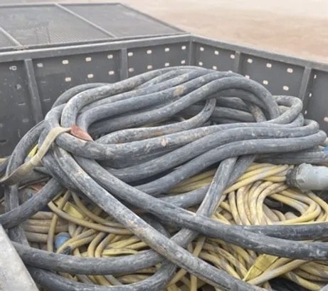 eMV cables stored loose and tangled in a trailer bed